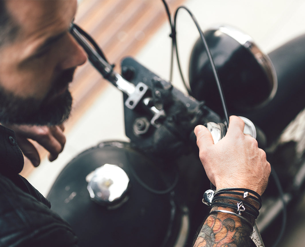 Man on a motor bike wearing a trollbeads leather bracelet